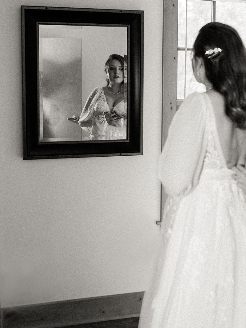 Bride getting dressed for wedding day.