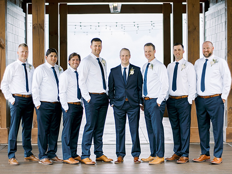 Groom and groomsmen posing at The Trillium Venue in Sevierville, TN.